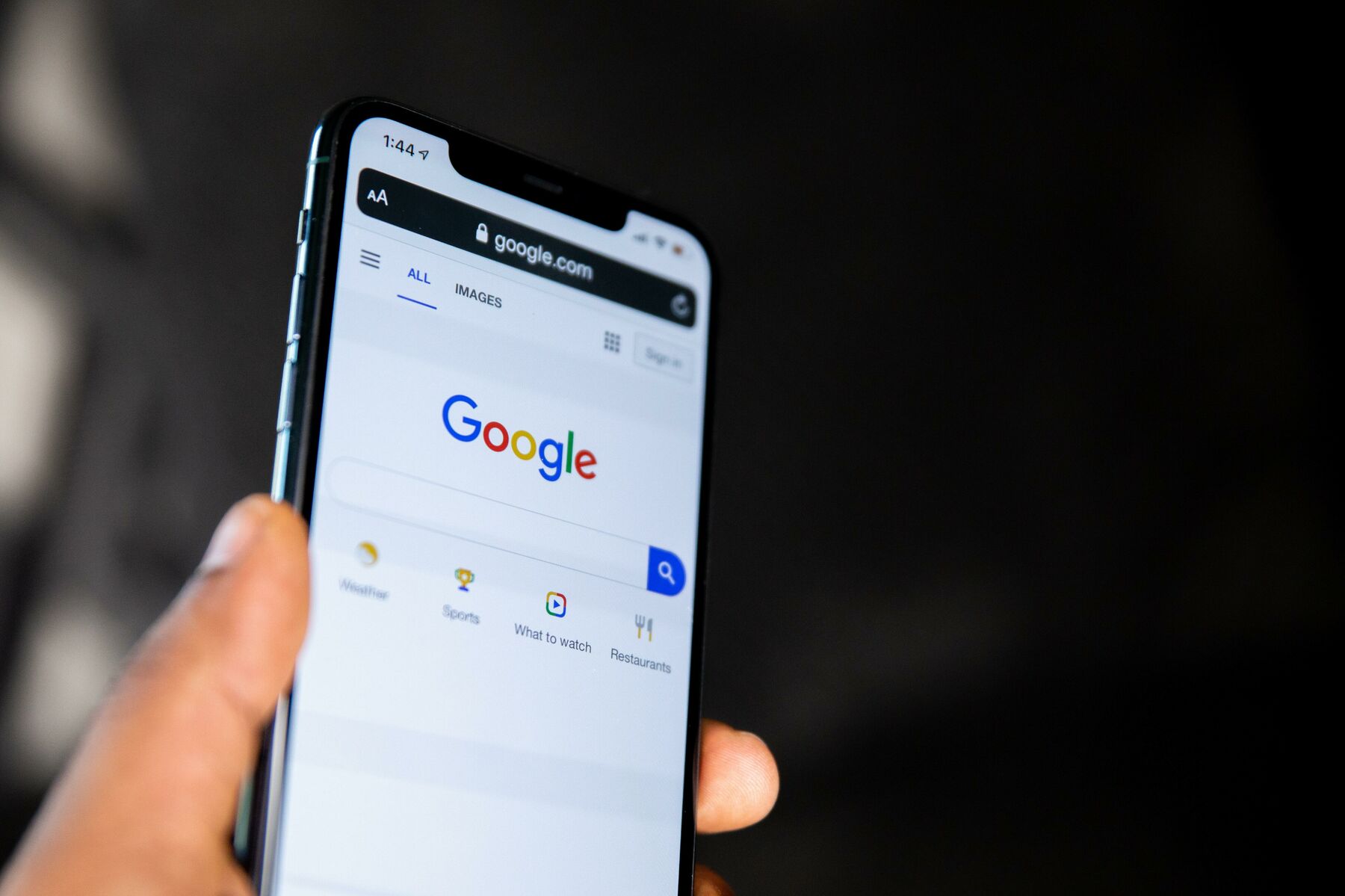Person holding a mobile phone