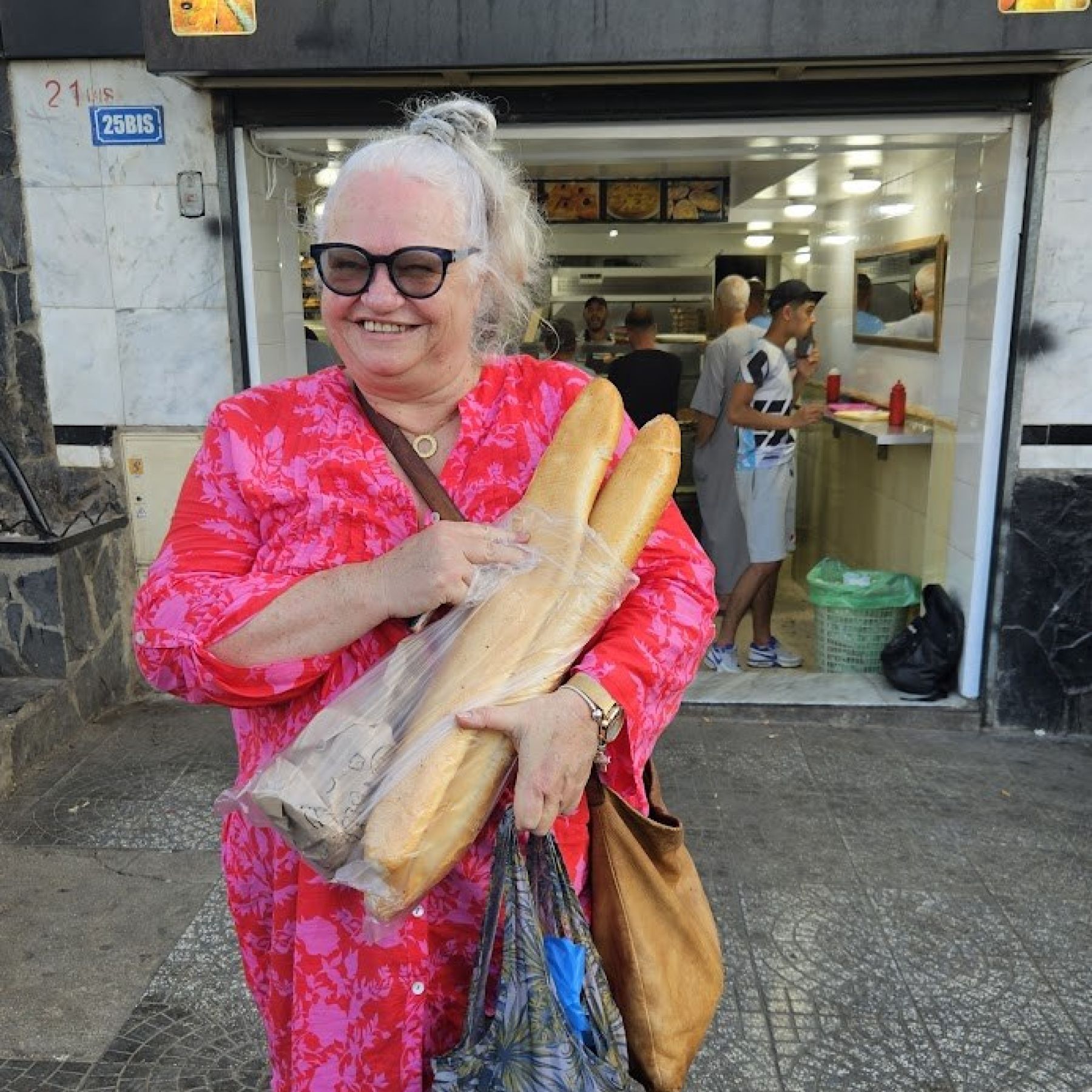 Caroline buying baguettes